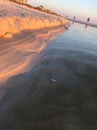 Scenic view of shore against sky