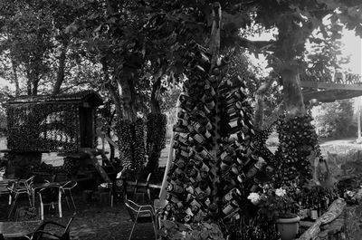 Empty chairs and table in yard