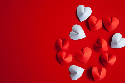 Close-up of heart shape over red background