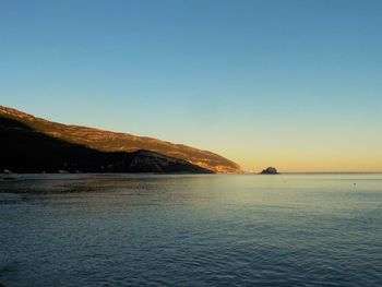 Scenic view of calm sea against clear sky