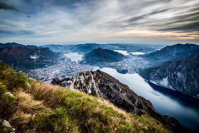 Scenic view of snow covered mountain against cloudy sky