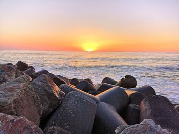 Scenic view of sea against sky during sunset