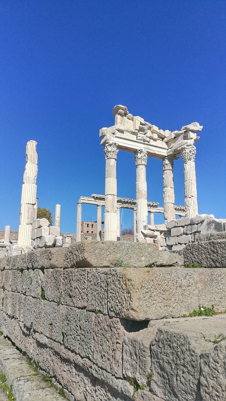 LOW ANGLE VIEW OF OLD RUIN AGAINST BLUE SKY