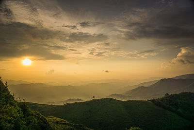 Scenic view of mountains against sky during sunset