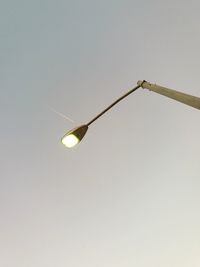 Low angle view of light bulb against clear sky