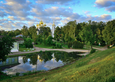 Scenic view of lake against cloudy sky