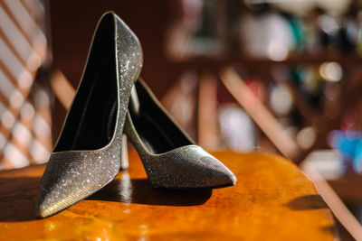 Close-up of shoes on table