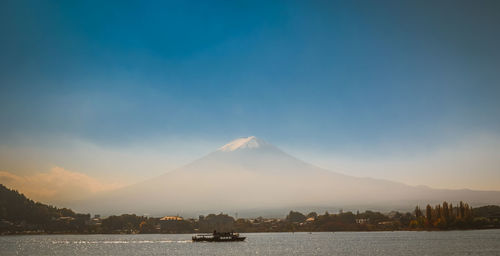 Scenic view of mt fuji by lake against sky