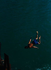 High angle view of man swimming in sea