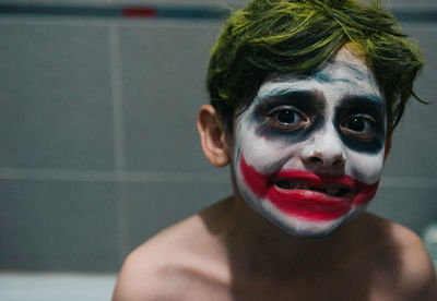 Portrait of shirtless boy with face paint