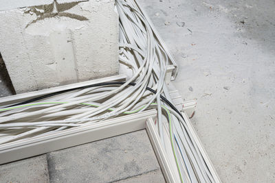 Layed installation of electric cables on the floor in a newly built house. cables lying in plastic