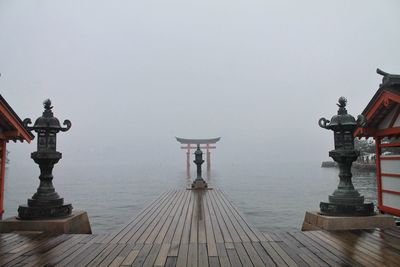 Pier against sky in foggy weather