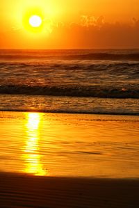 Scenic view of sea at sunset