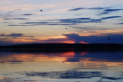 Scenic view of lake against sky during sunset