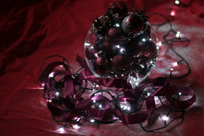 Close-up of illuminated christmas lights on table
