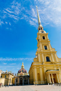 Low angle view of church against cloudy sky