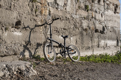 Bicycle leaning against wall