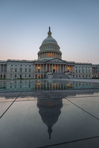 View of east side of the national us capitol building against clear sky after the sunset