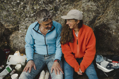 Two people sitting outdoors