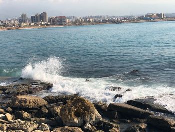 Scenic view of sea and cityscape