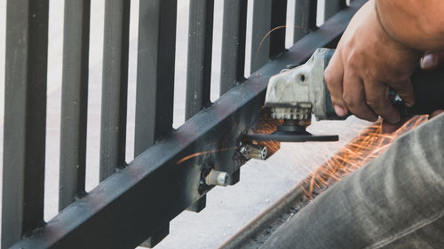 High angle view of man working on metal