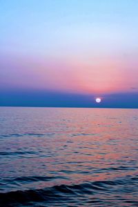 Scenic view of sea against sky at sunset