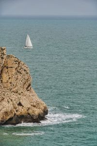 Scenic view of sailboat against sky