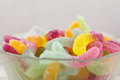 Close-up of multi colored candies against white background