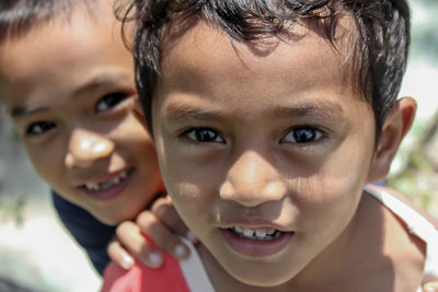 Close-up portrait of smiling boy