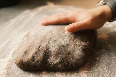 Cropped hand of person preparing food