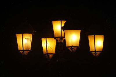 Illuminated light bulb in the dark