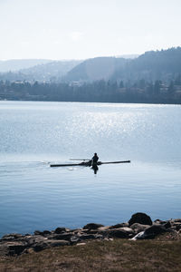 Nautical vessel on lake against sky