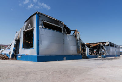 View of industrial building against blue sky