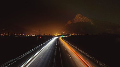 Light trails on road at night