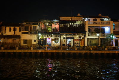 Reflection of illuminated buildings in canal at night