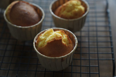 There are several delicious lemon honey cupcakes just made on the table