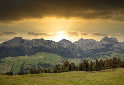 Scenic view of landscape against sky during sunset