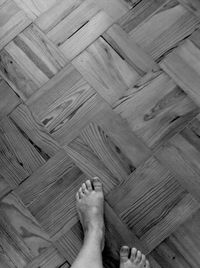 Low section of people relaxing on wood