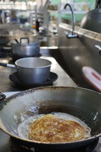 Close-up of cooking pan in kitchen