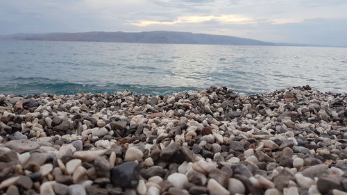 Pebbles on shore at beach