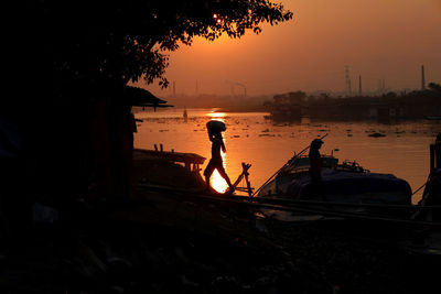 Workers at work before sunset