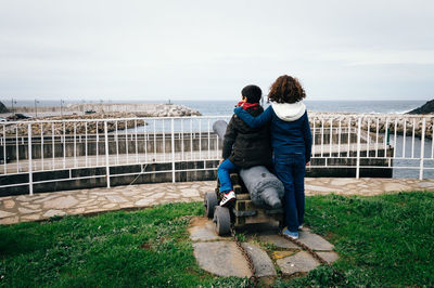 Rear view of woman looking at sea