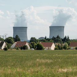 Built structure on field against sky