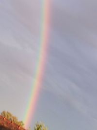 Low angle view of rainbow against sky