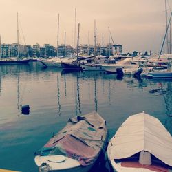 Boats moored at harbor