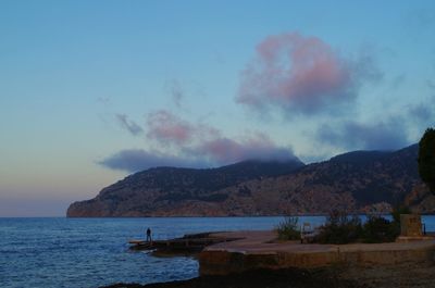 Scenic view of sea against cloudy sky