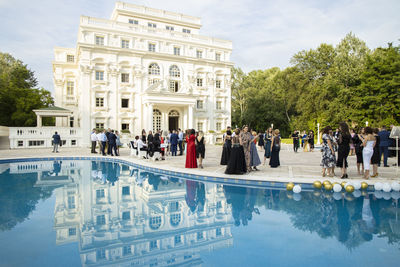 Group of people in front of swimming pool