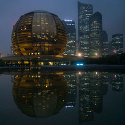 Illuminated buildings in city at night