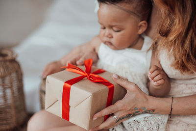 High angle view of mother and daughter in box