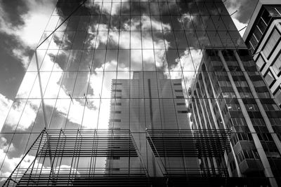 Low angle view of modern skyscraper against sky